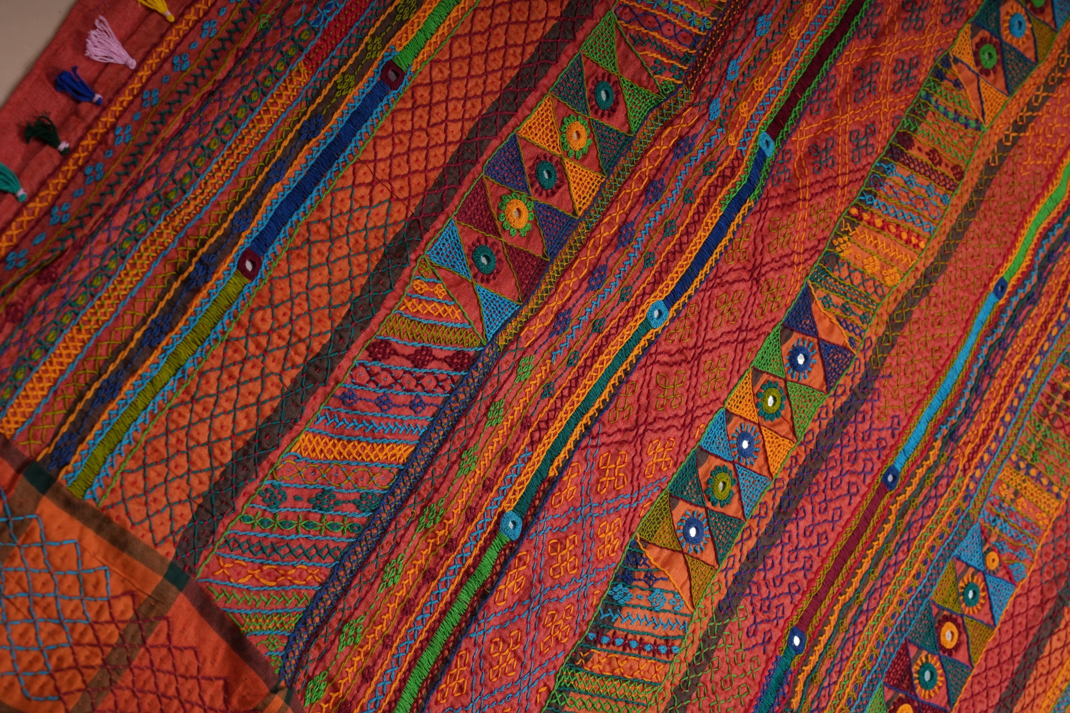 Rust Orange Tusser Silk Lambani Saree with Multicolor Embroidered Pallu